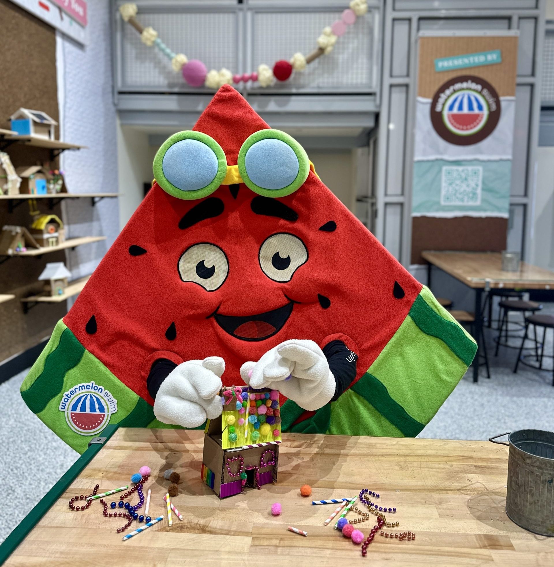 Mascot Slyce building a gingerbread house